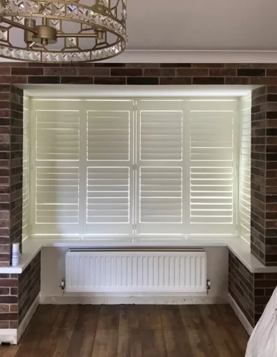 square box bay shutters living room after